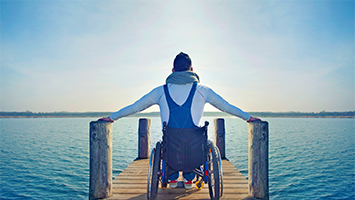 1230084-Man_in_wheelchair_on_a_jetty_-U.png