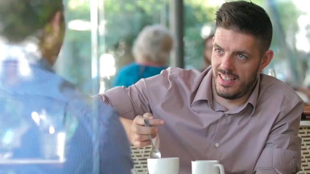 Michael Kerr relaxing in cafe with friend