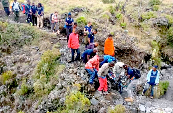 ina descending mount meru with assistance from mountain guides