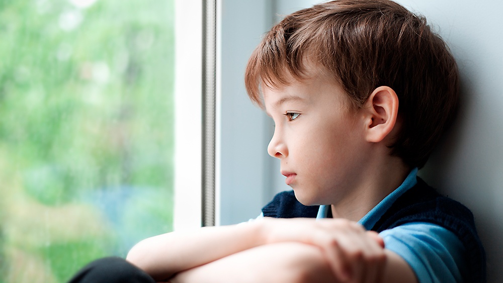 children-and-TAI-bowel-dysfunction-unhappy-child-gazing-out-of-window.jpg